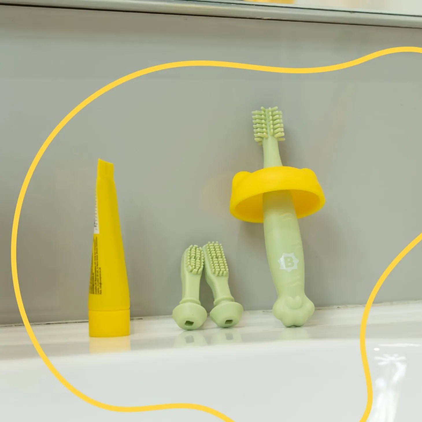 Badabulle Brosse à dents évolutive en silicone Vert/Jaune